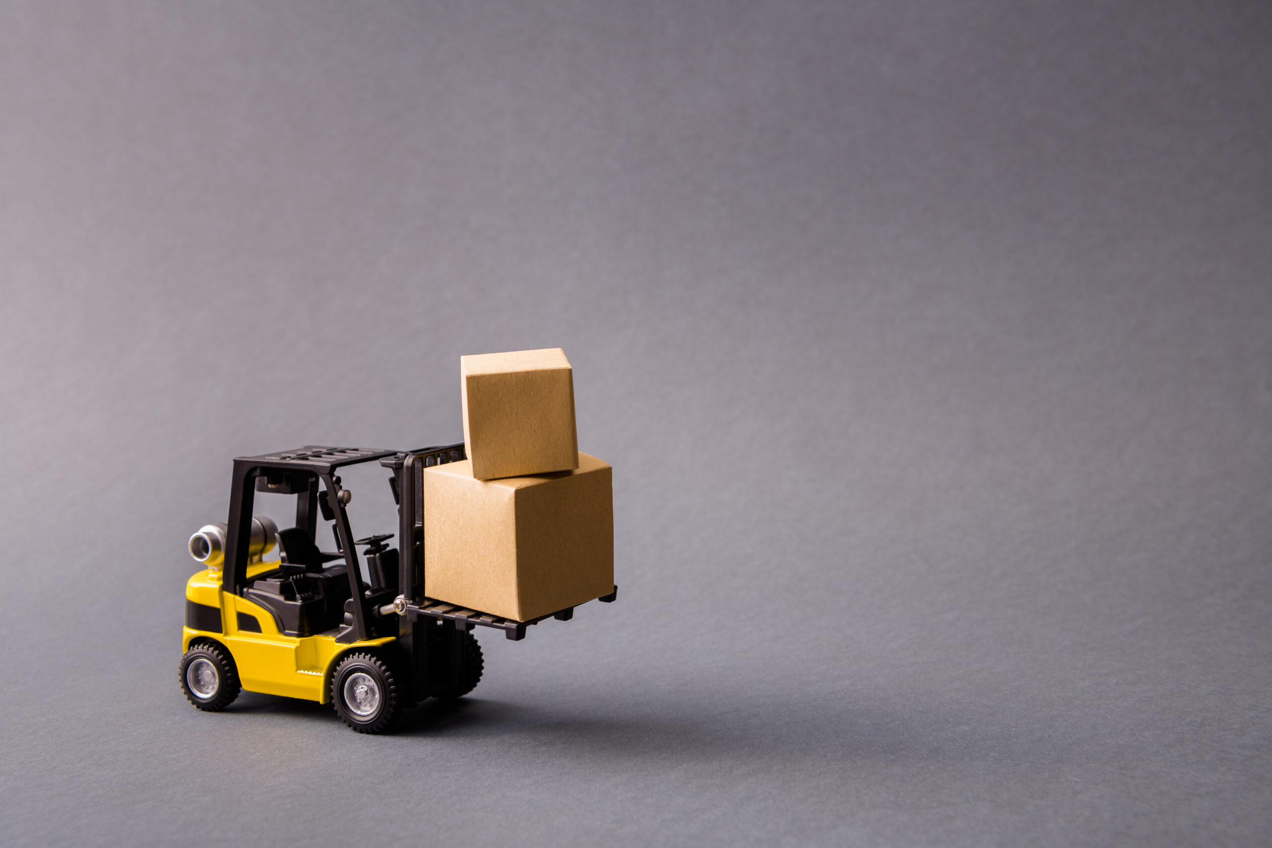 Photo of small electric truck carrying bringing delivering stuff in boxes fast shipment transportation isolated over dark pastel grey purple violet color background