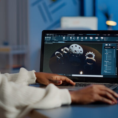 Tired african designer engineer analyzing new prototype