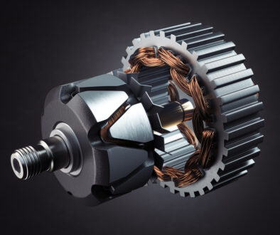 Rotor and stator of car alternator generator or electric motor on black.