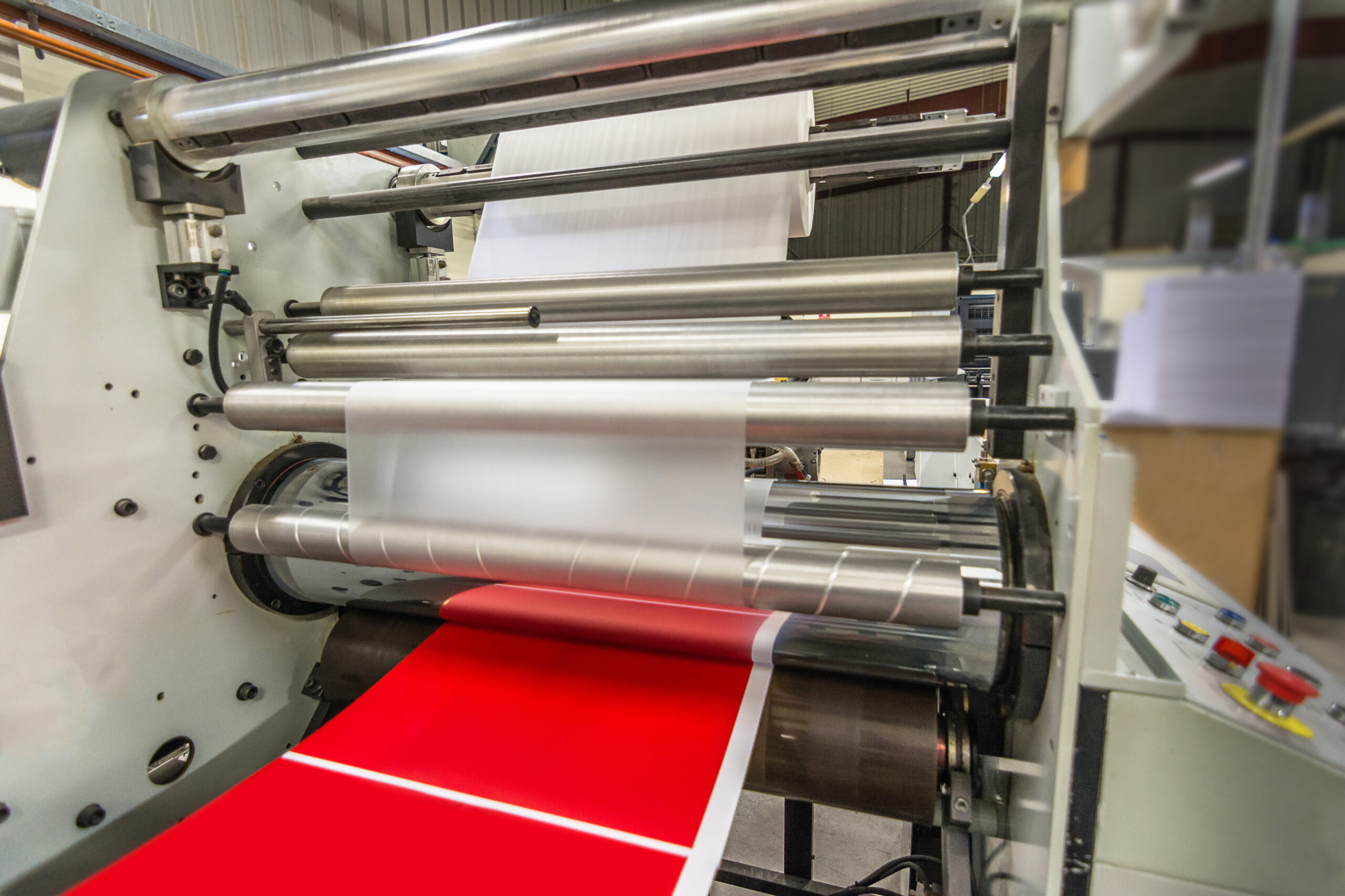 Matte or gloss plastic machine in a printing press for a perfect finish of printed documents.